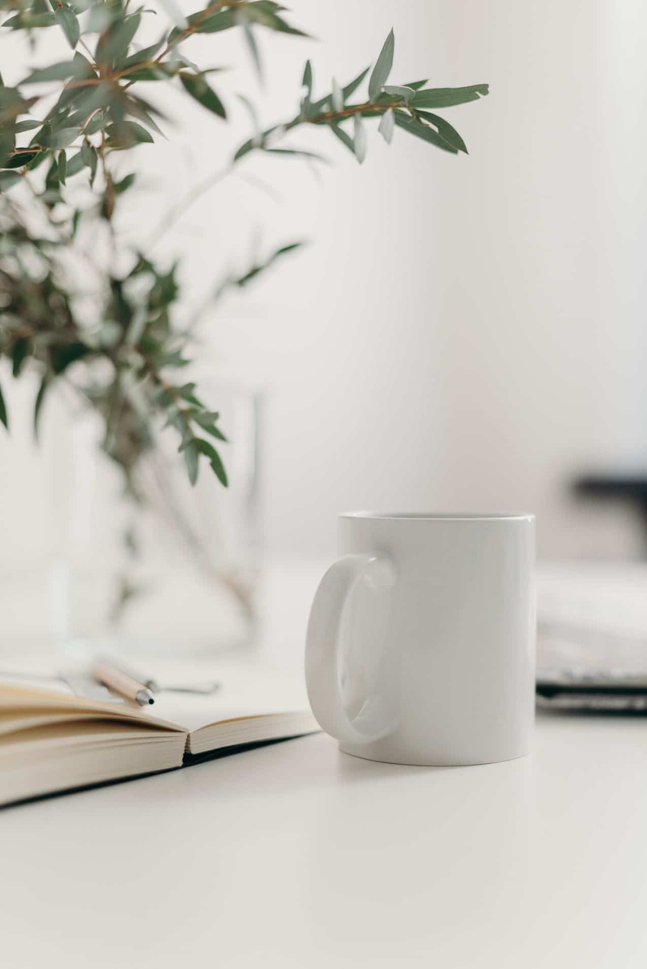 white mug on the table of a white office