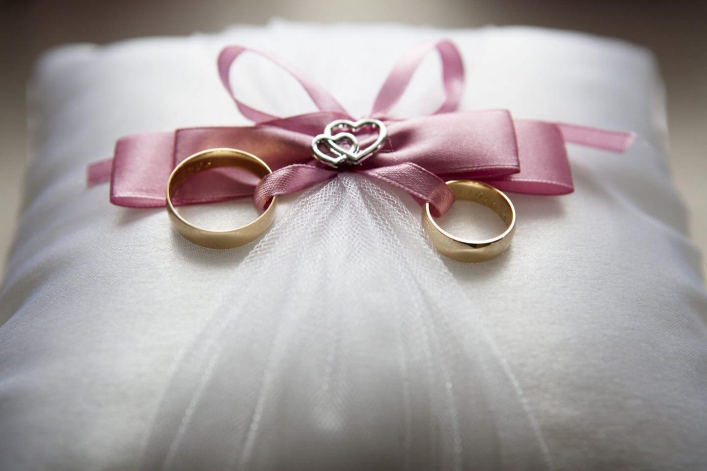 wedding rings on pillow