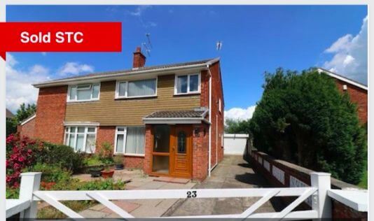 Our old house with the Sold sign at the front