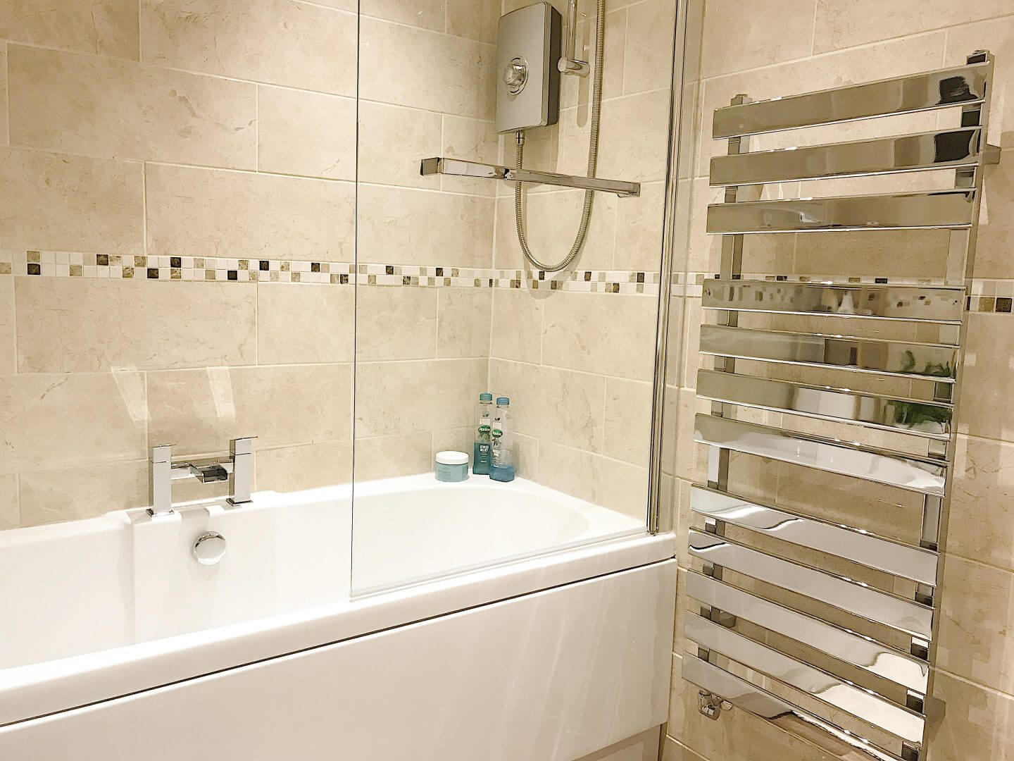 Bathroom with towel rail and glass screen