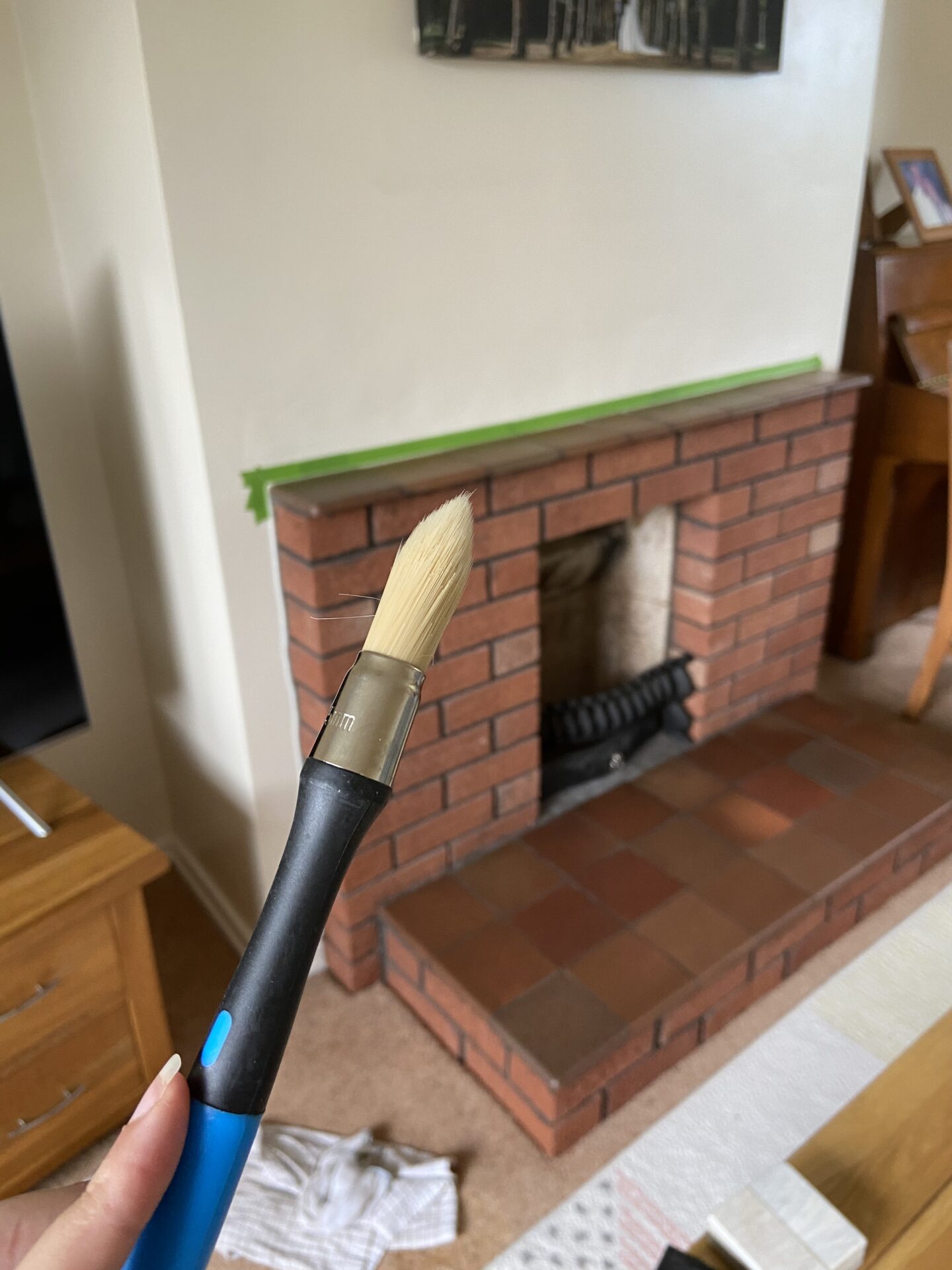 The fireplace with frog tape in place