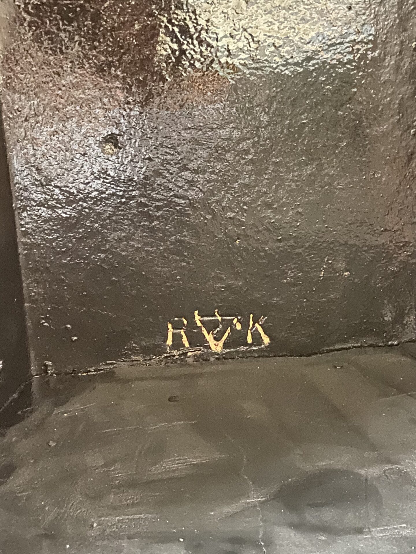 Initials engraved into the back of the fireplace that I discovered