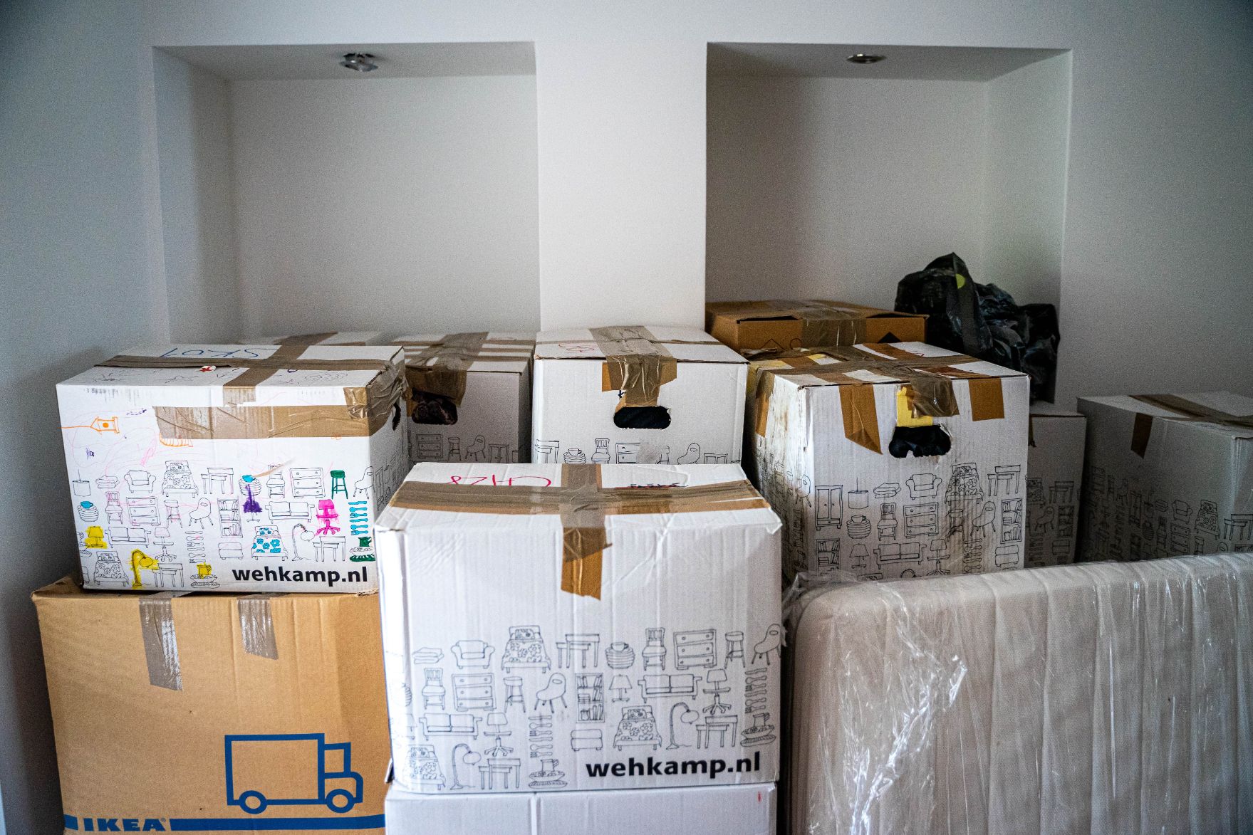 Boxes all packed up in a room for a home move.