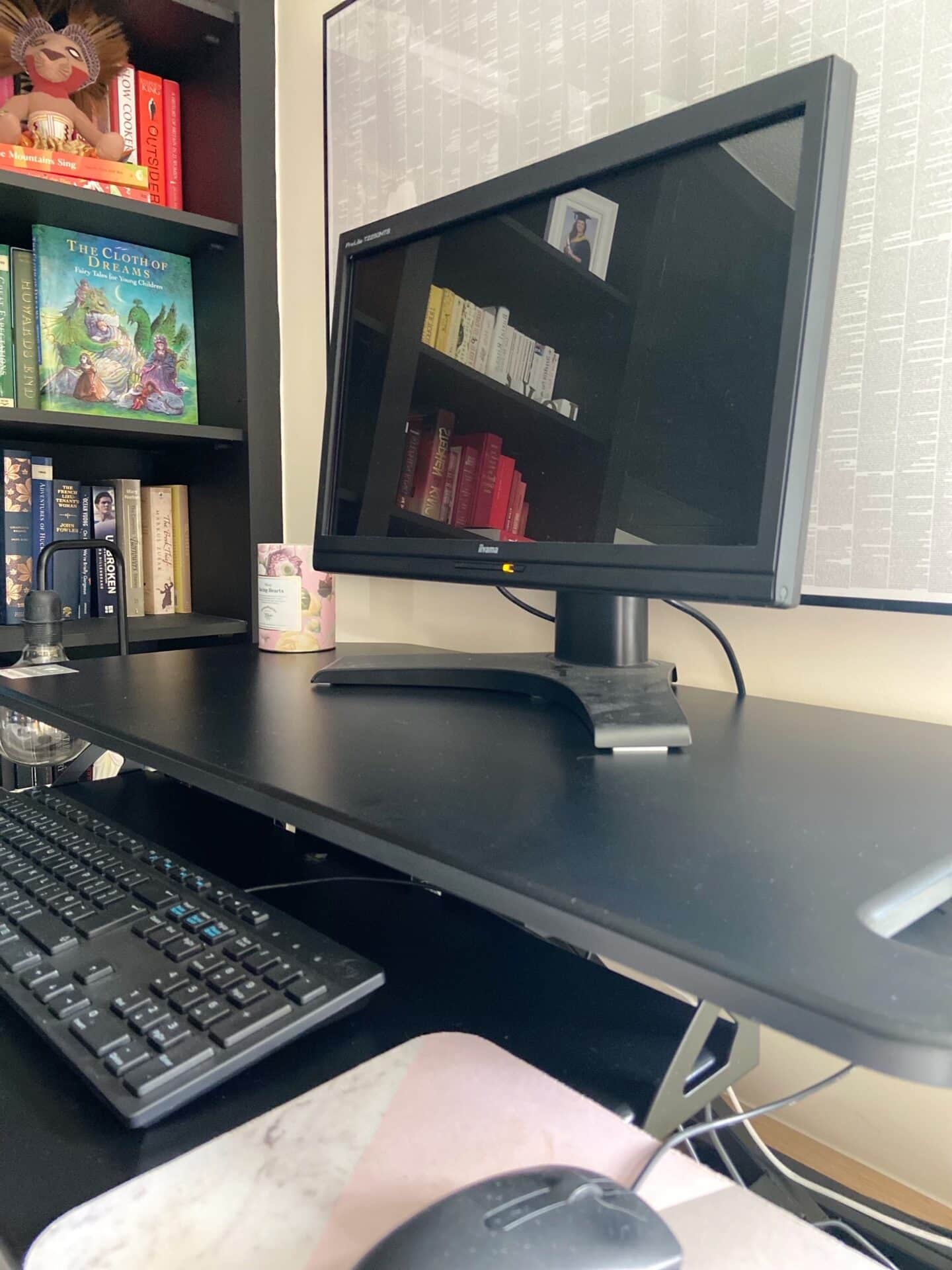 A close up of the standing desk at home