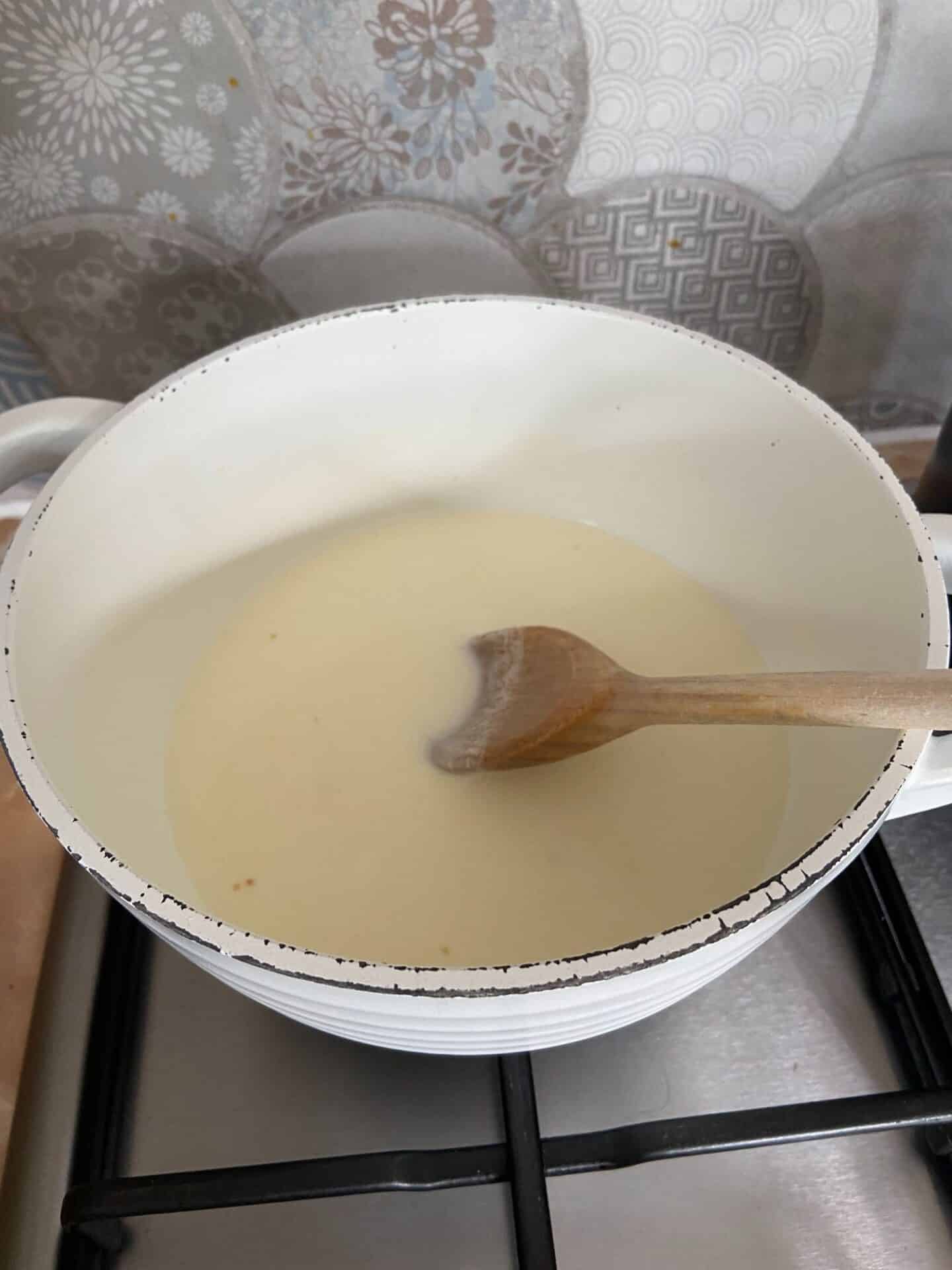 Creme fraiche and wine mixture in a pan