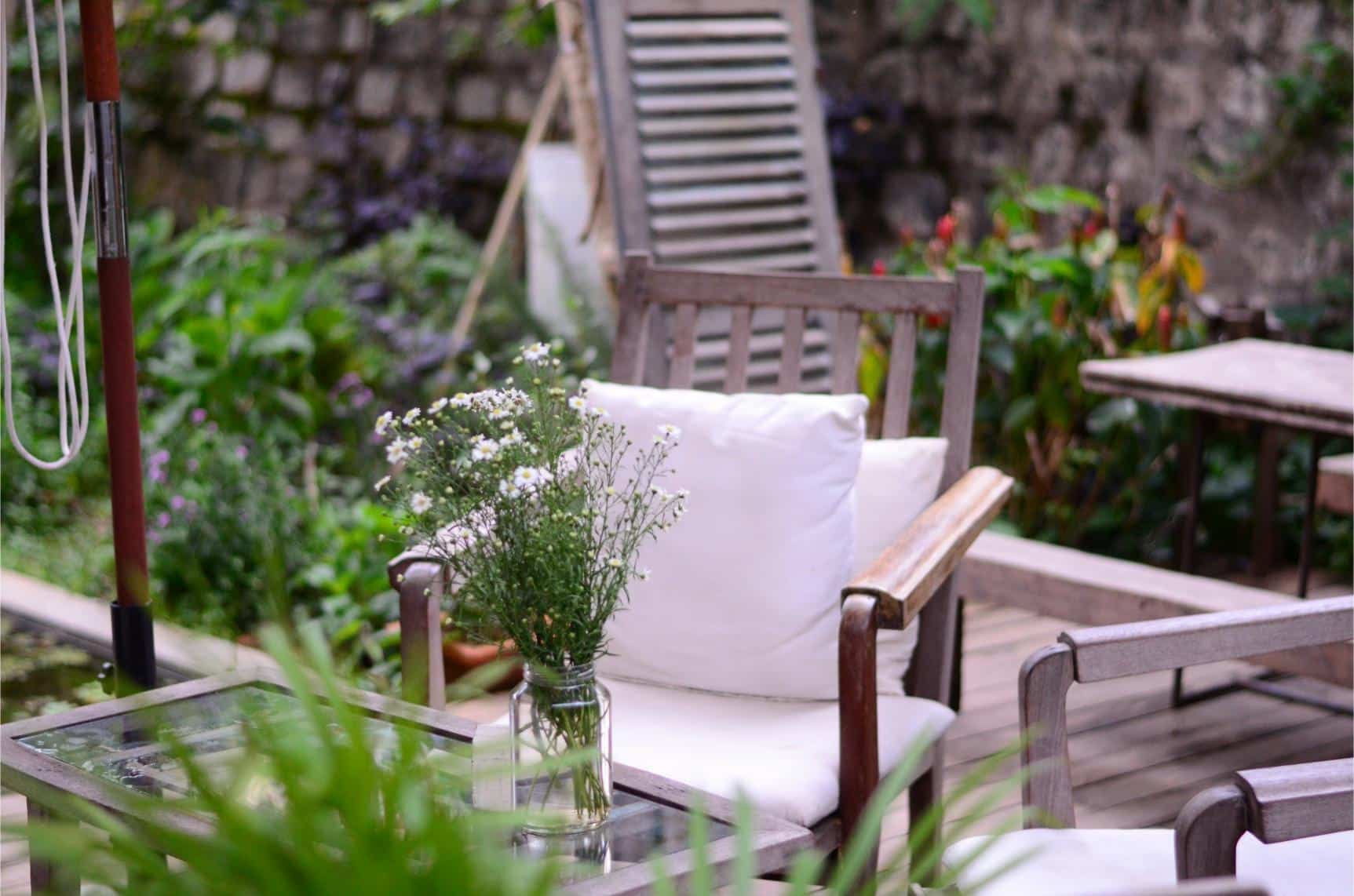 Garden in London with a small table and chairs on a decked area