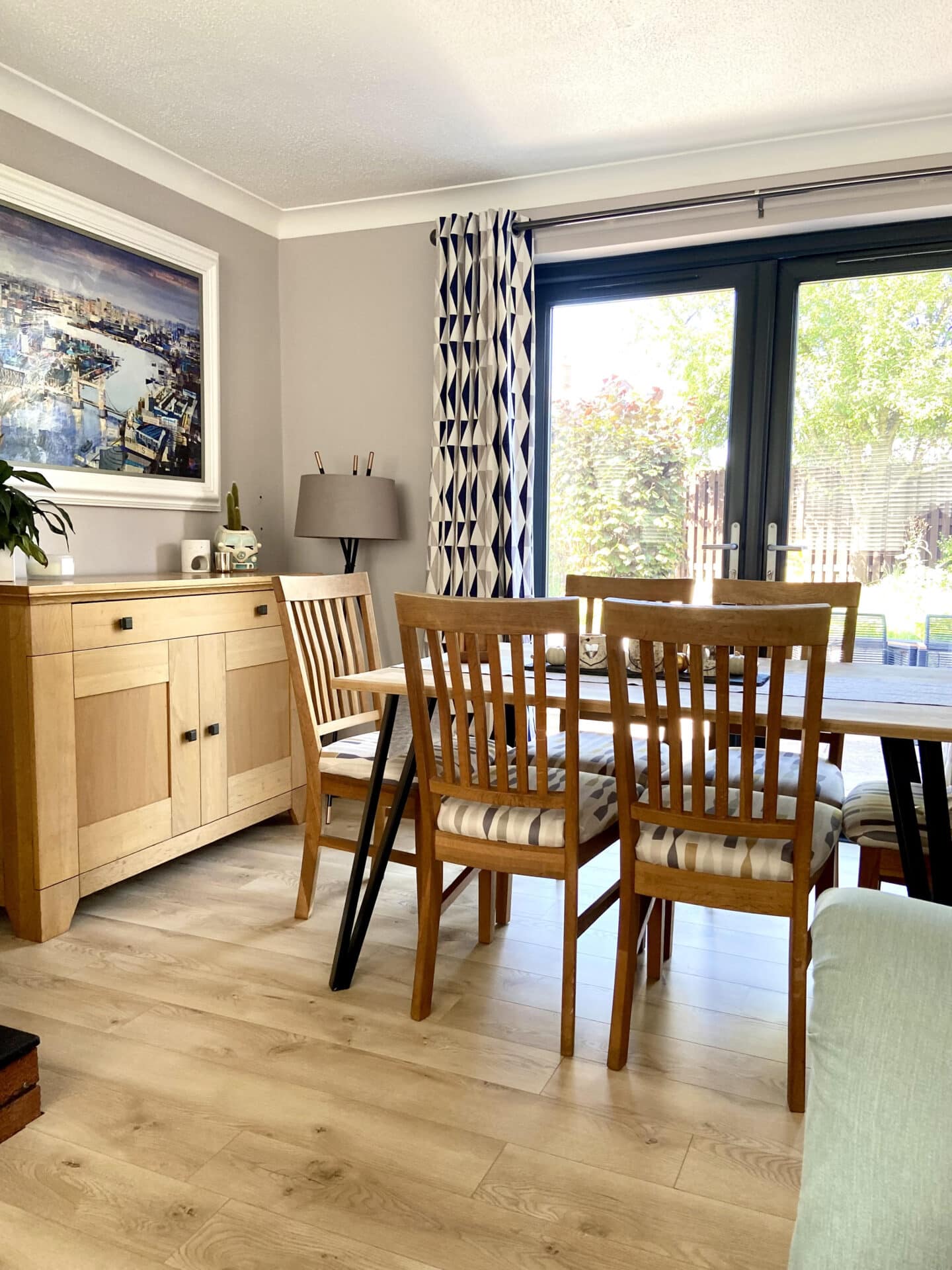 The French doors in our home with our dining table in front of them