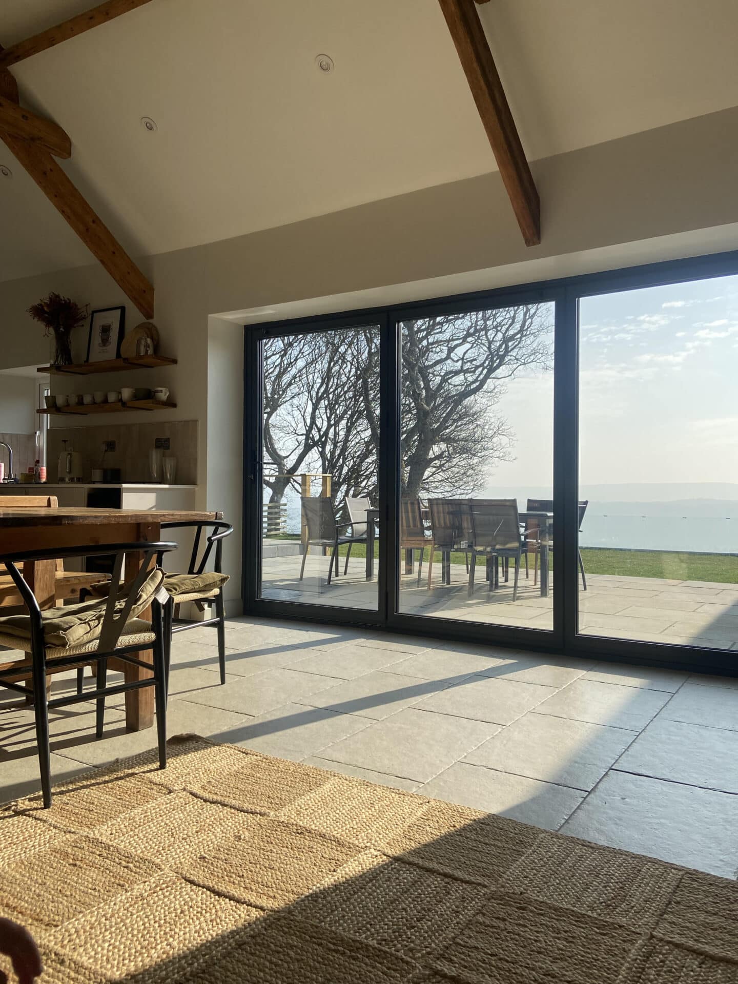 Beautiful dark grey aluminium bifold doors at a holiday home in Conwy