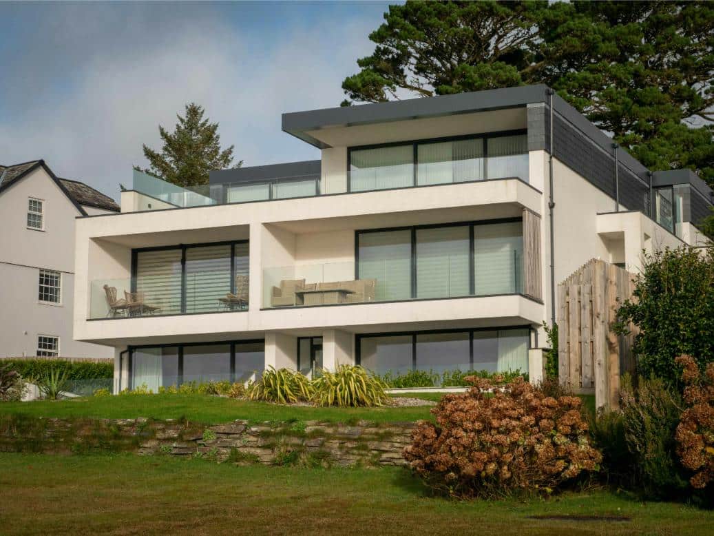A new build home with modern frontage and white rendering