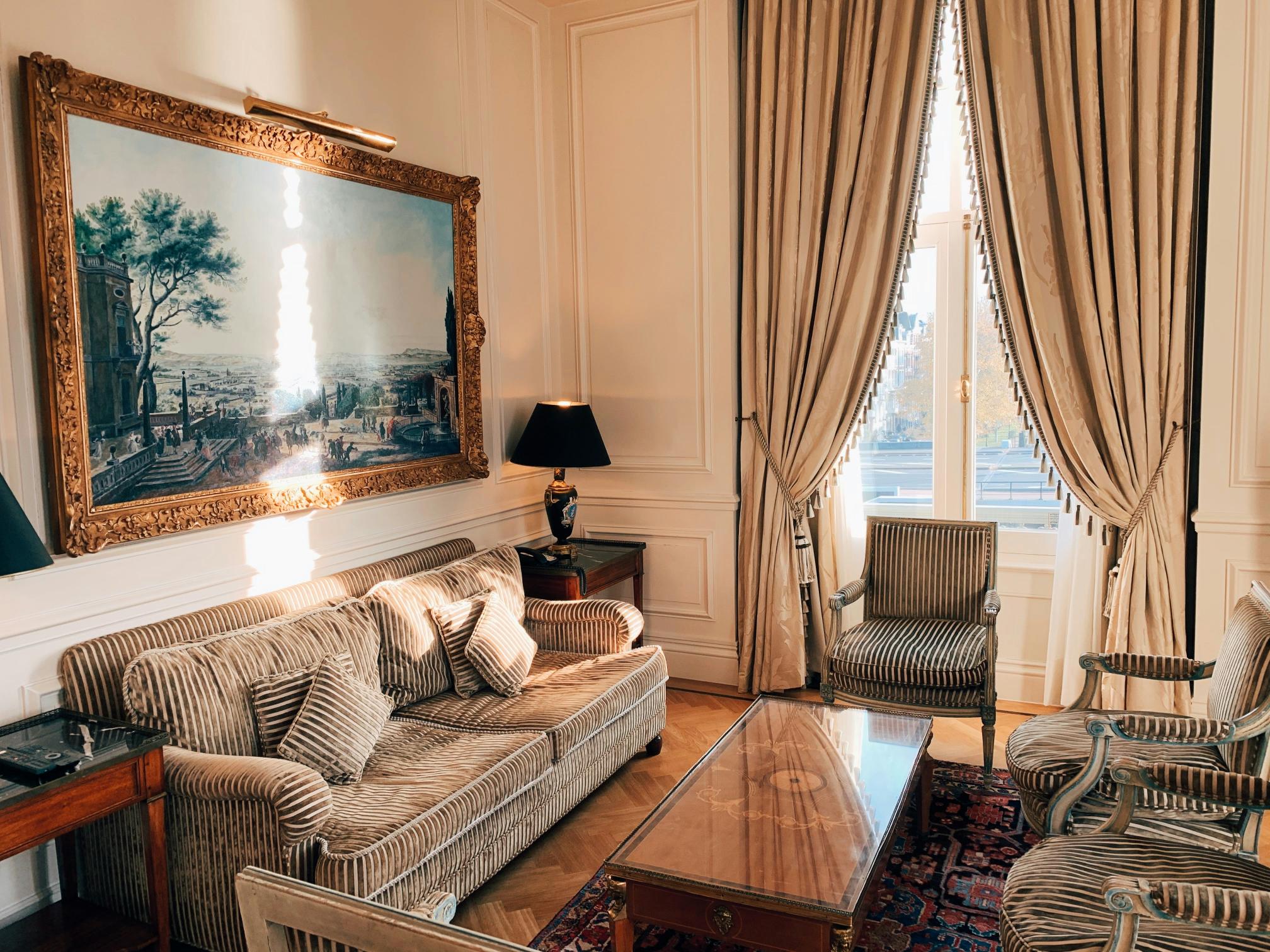 A beautiful old building with panelled walls with a modern sofa