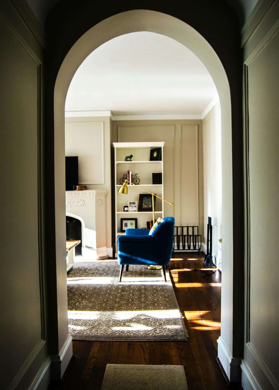 A view into a living room through an archway