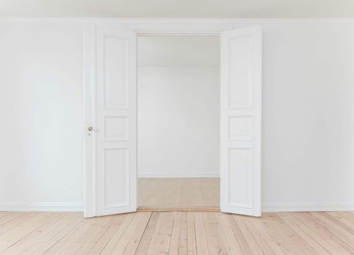 Double pre-hung doors opening into an empty room