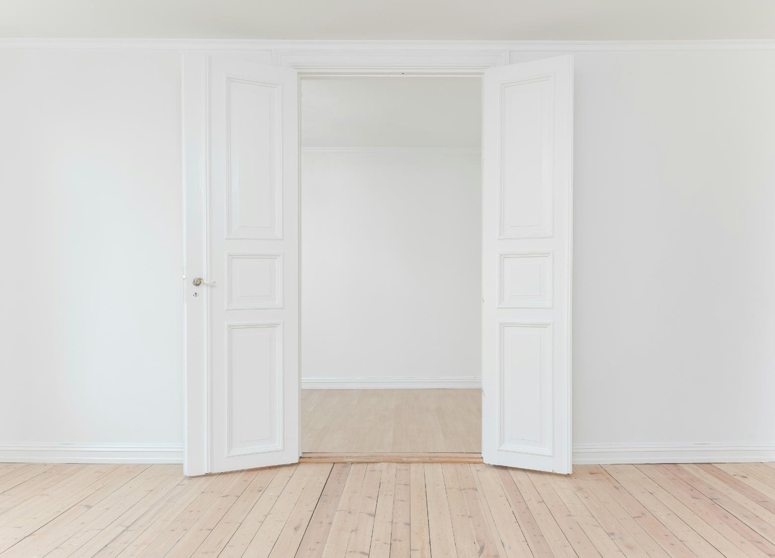 Double pre-hung doors opening into an empty room