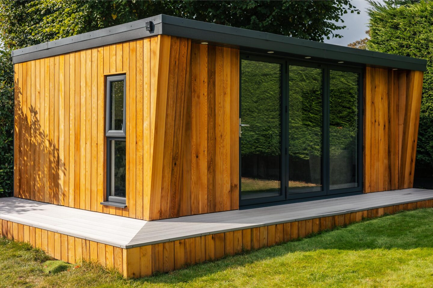 A large office pod with wooden panelling and glass front