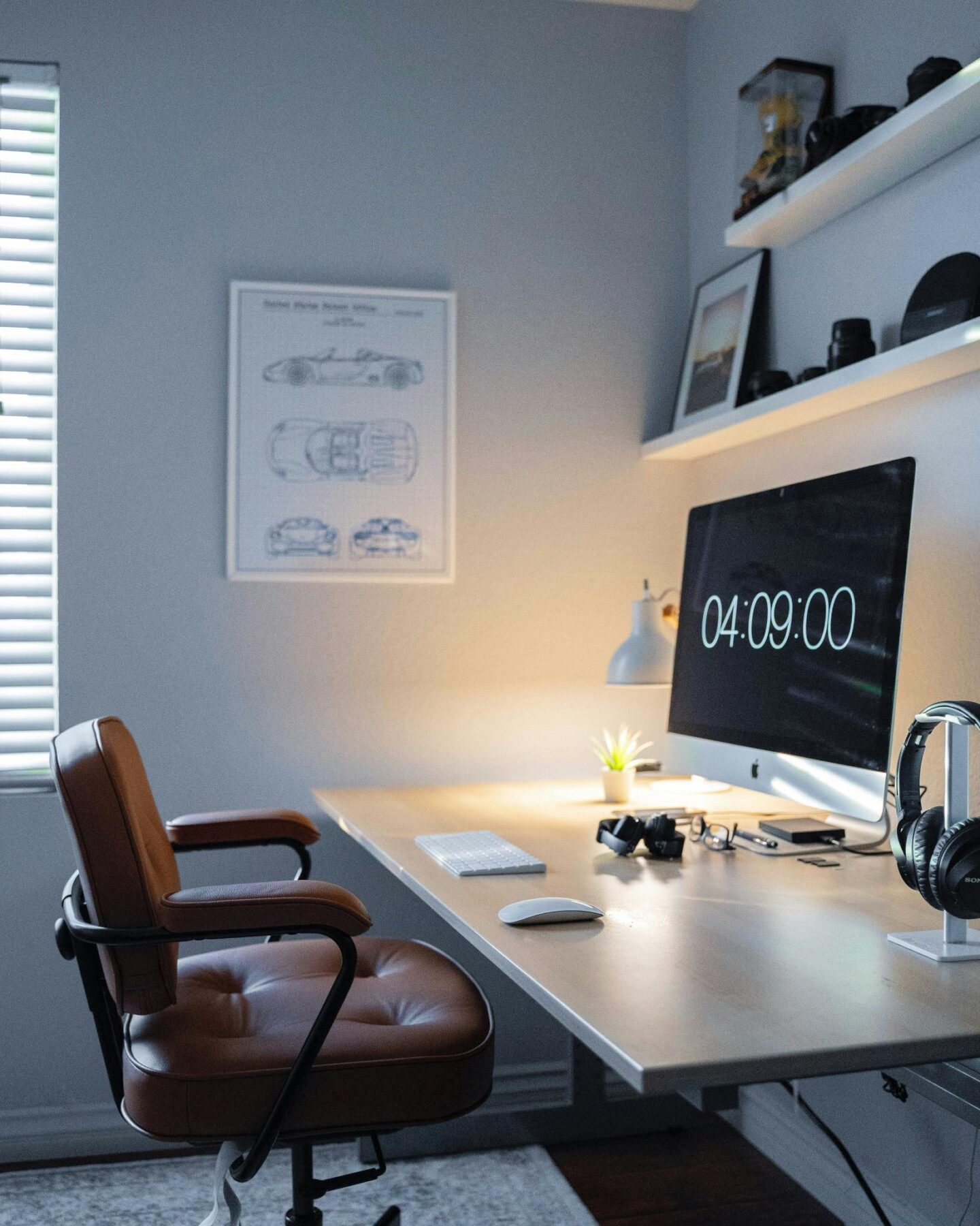 A modern office with leather office chair and gentle lighting