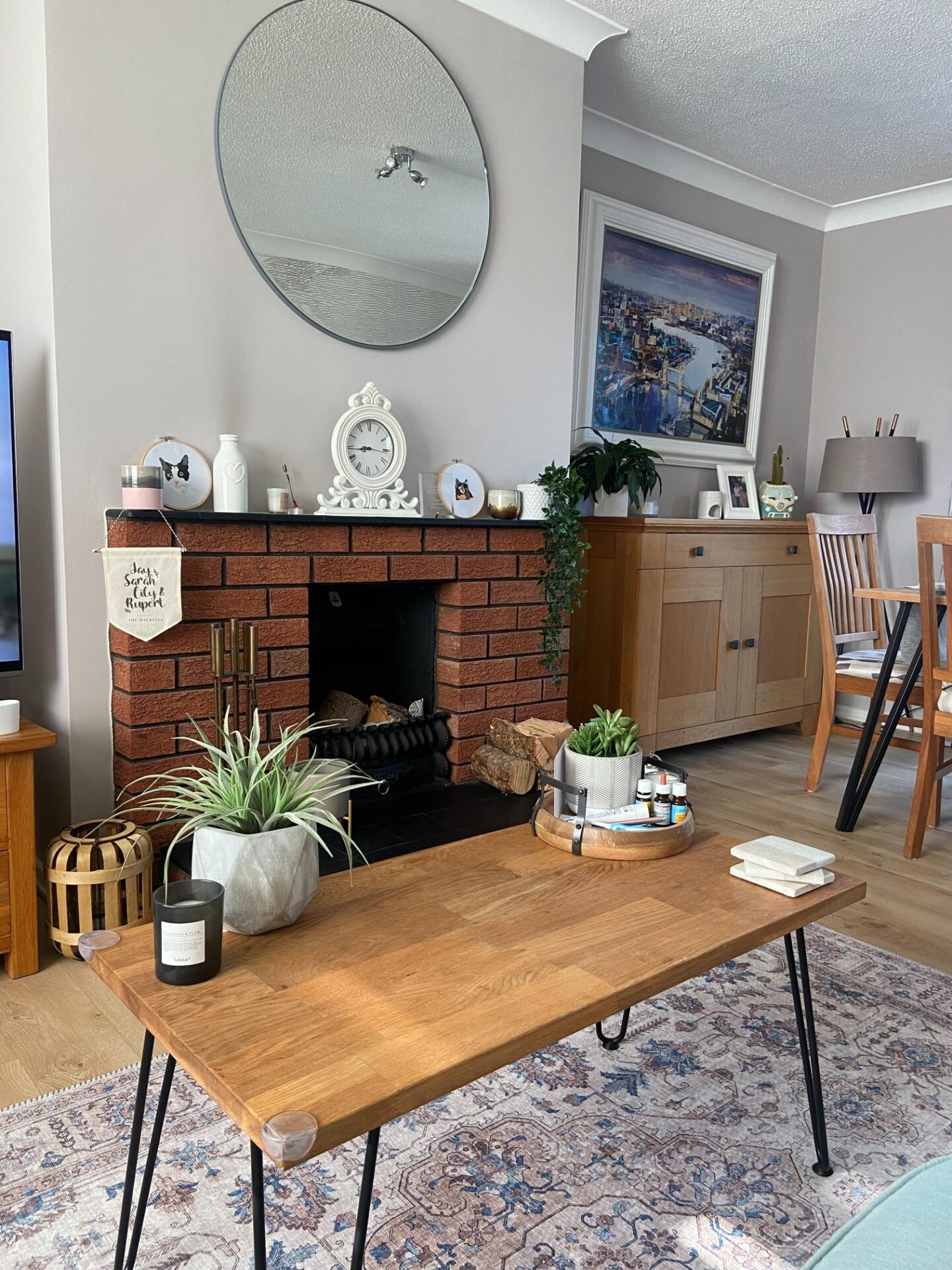 Our lounge with a coffee table in front of the fireplace with a black hearth