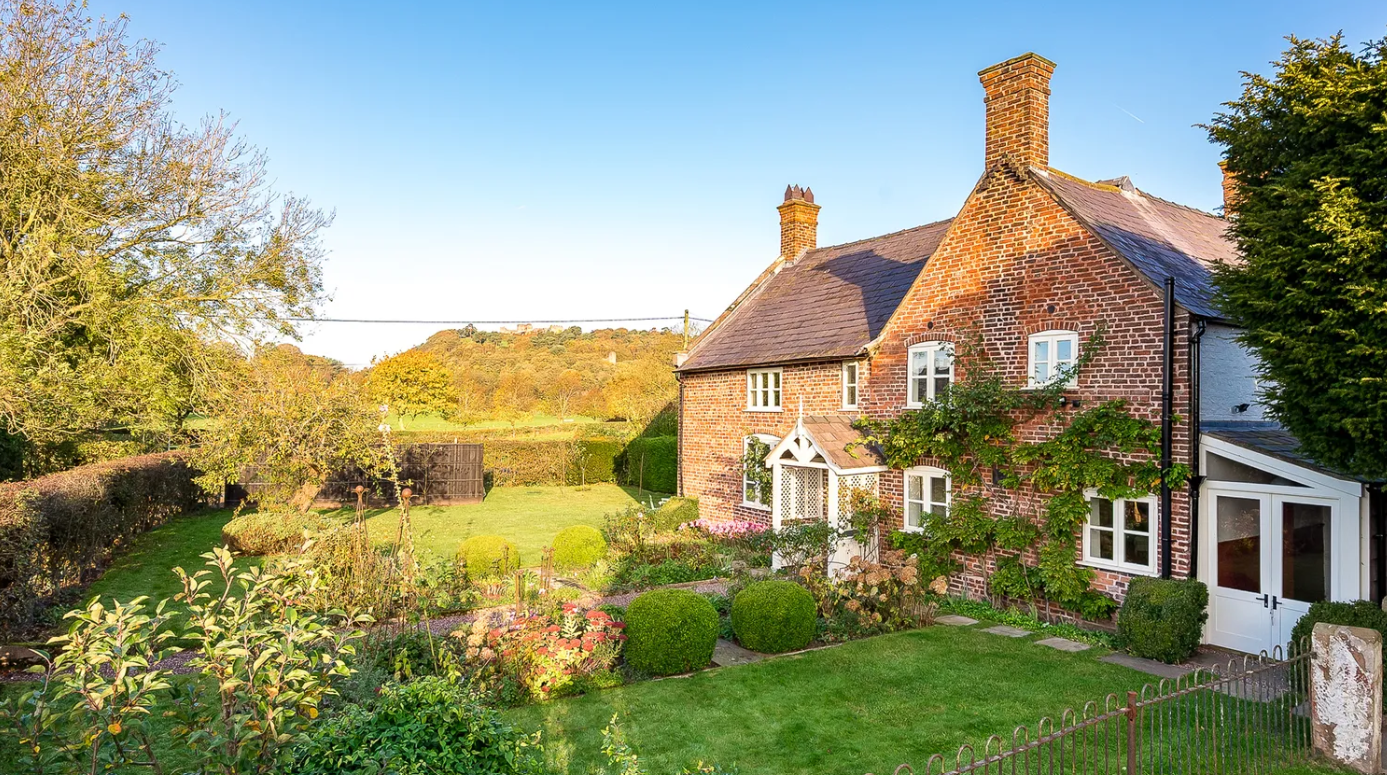 Another view of the front of Wheelwrights Cottage, showing off the incredible views and its immaculate garden